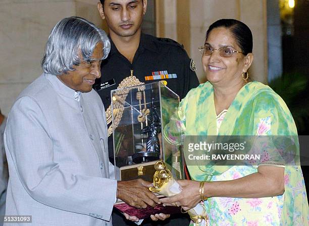 Mother of Indian cricketer Harbhajan Singh, Avatar Kaur receives the prestigious Arjuna Award on his behalf, from Indian President A.P.J. Abdul Kalam...