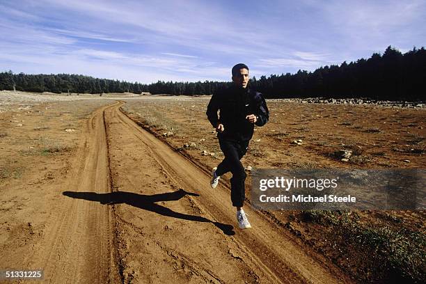 Hicham El Guerrouj of Morocco in full stride during an early morning training run at the training centre in Ifrane, Morrocco on January 15 2002....