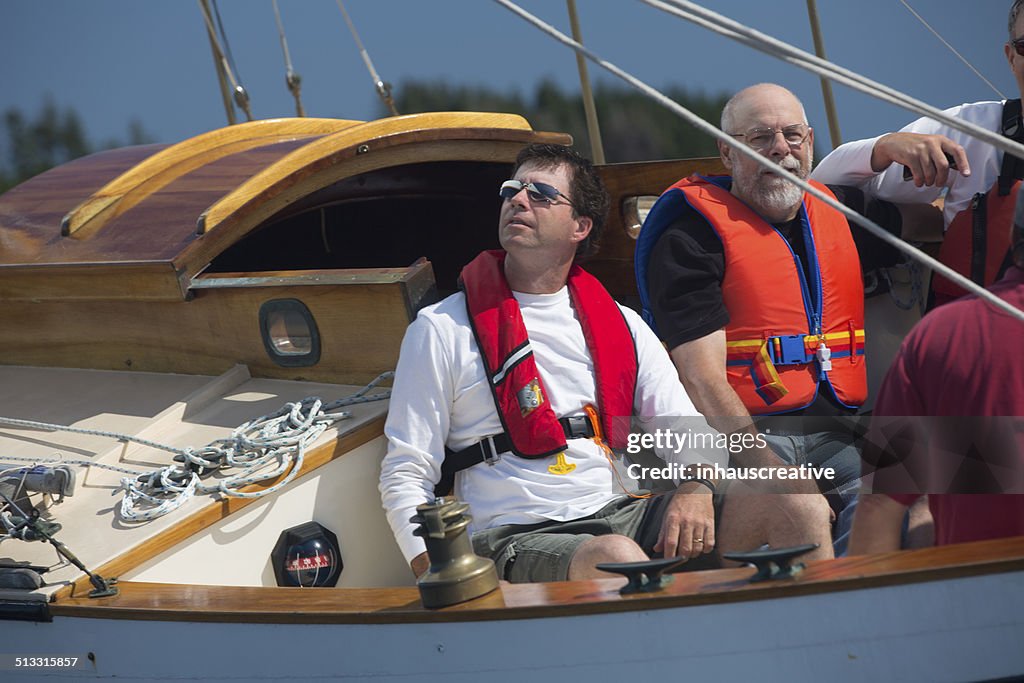 Guys enjoying sailing