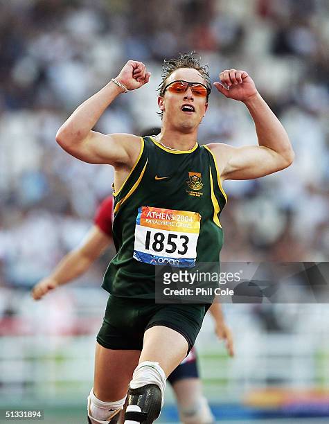 Oscar Pistorius of South Africa wins the 200m T44 for Men at the Athens 2004 Paralympic Games on September 21, 2004 at the Olympic Stadium in Athens,...