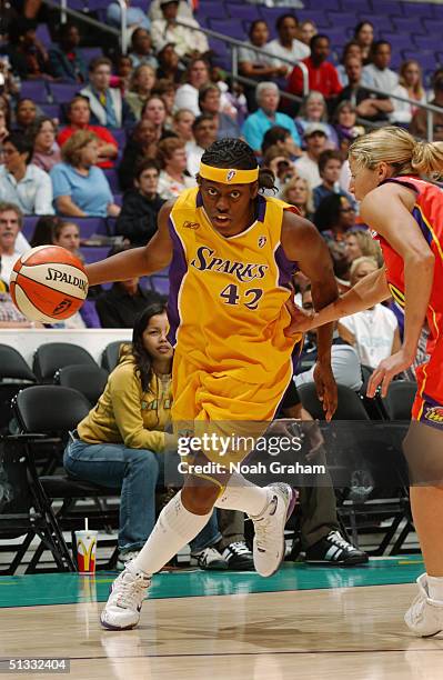 Nikki Teasley of the Los Angeles Sparks drives against the Phoenix Mercury during the game at Staples Center on September 14, 2004 in Los Angeles,...