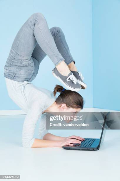 gymnast working on her laptop - contortionist stock pictures, royalty-free photos & images