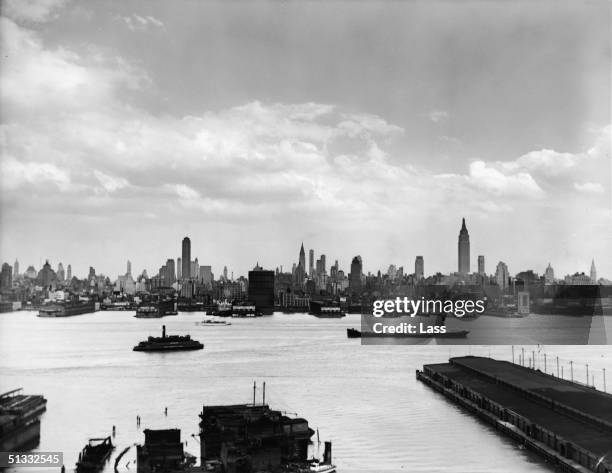 View of the New York City skyline as seen from the Hudson River, New York, New York, circa 1940s