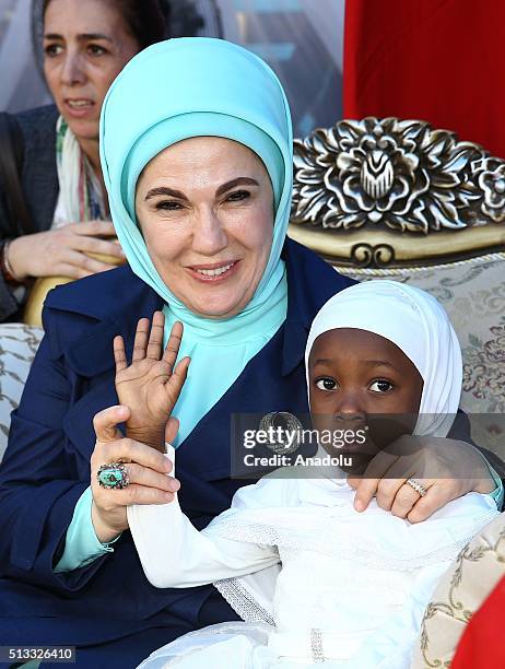 Turkish President Recep Tayyip Erdogan's wife Emine Erdogan and Nigerian President Muhammadu Buhari's wife Aisha Buhari take cares with orphan...