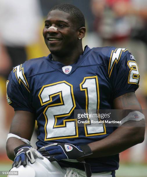 LaDainian Tomlinson of the San Diego Chargers kneels on the sidelines before the game against the Houston Texans on September 12, 2004 at Reliant...