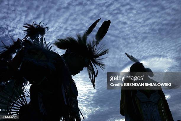 Harrison Revels and his cousin Courtney Baxter , members of the Lumbee Tribe in North Carolina, wait for a tribal dance on the National Mall after...