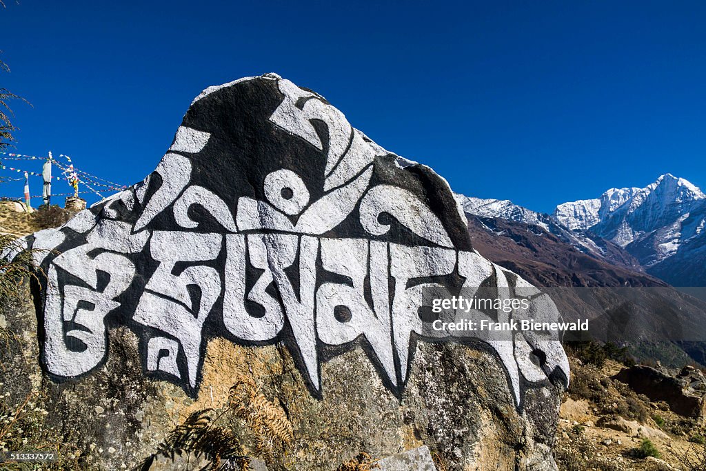 Big Mani stone with the tibetean mantra Om mani padme hum...