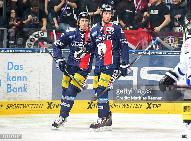 Marcel Noebels and Barry Tallackson of the Eisbaeren Berlin celebrate after scoring the 1:0 during the game between the Eisbaeren Berlin and the...