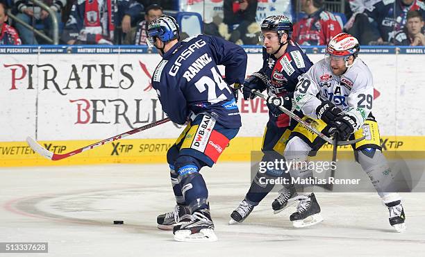 Andre Rankel, Mark Olver of the Eisbaeren Berlin and Yan Stastny of the Schwenninger Wild Wings during the game between the Eisbaeren Berlin and the...