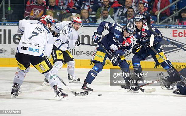 Sascha Goc, Damien Fleury of the Schwenninger Wild Wings, Julian Talbot and Micki DuPont of the Eisbaeren Berlin during the game between the...