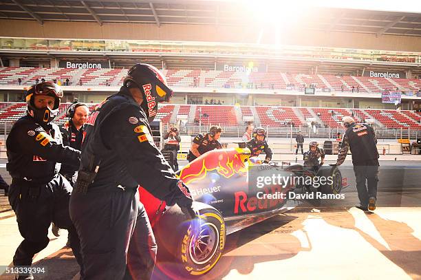 Daniel Ricciardo of Australia and Red Bull Racing is pushed back into the garage during day two of F1 winter testing at Circuit de Catalunya on March...