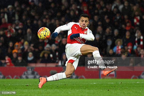 Alexis Sanchez of Arsenal miss kicks during the Barclays Premier League match between Arsenal and Swansea City at the Emirates Stadium on March 2,...