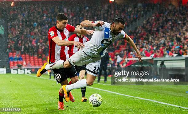 Oscar De Marcos of Athletic Club Bilbao competes for the ball with Jonas Gutierrez of Deportivo La Coruna during the La Liga match between Athletic...