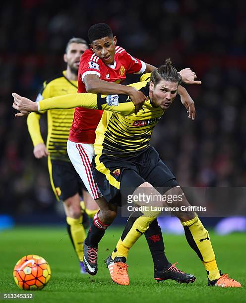 Marcus Rashford of Manchester United challenges Sebastian Prodl of Watford for the ball during the Barclays Premier League match between Manchester...