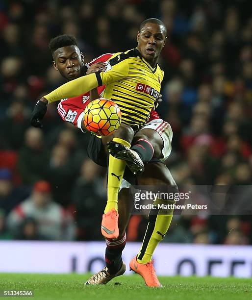 Timothy Fosu-Mensah of Manchester United in action with Odion Ighalo of Watford during the Barclays Premier League match between Manchester United...