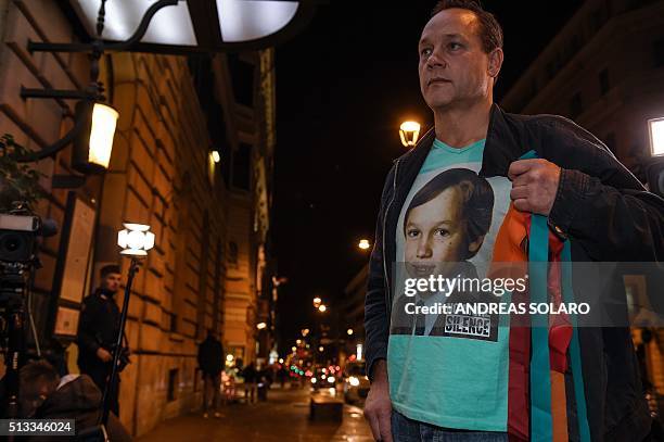 Catholic abuse victim Peter Blenkiron, wearing a T-shirt showing him at the age he was abused, arrives at the Quirinale hotel in Rome on March 2,...