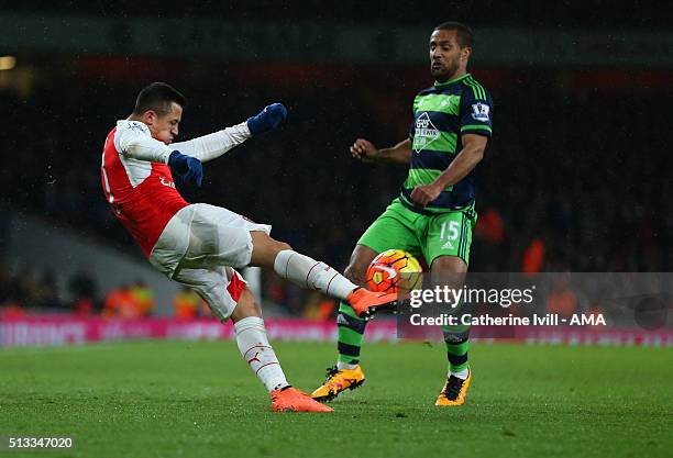 Alexis Sanchez of Arsenal and Wayne Routledge of Swansea City during the Barclays Premier League match between Arsenal and Swansea City at the...