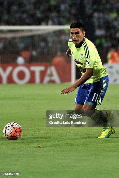 Irven Avila of Sporting Cristal drives the ball during a group stage match between Atletico Nacional and Sporting Cristal as part of Copa...
