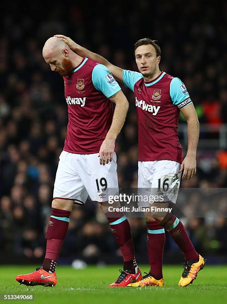 James Collins is consoled by Mark Noble of West Ham United as he is substituted during the Barclays Premier League match between West Ham United and...