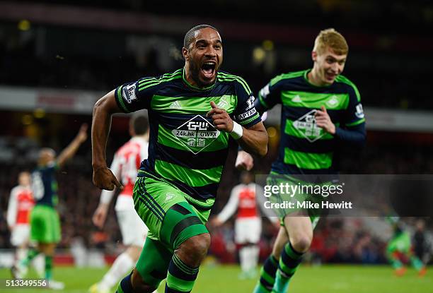 Ashley Williams of Swansea City celebrates scoring his sides second goal during the Barclays Premier League match between Arsenal and Swansea City at...