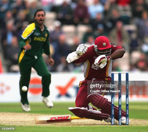 Brian Lara of West Indies is felled by a bouncer from Shoaib Akhtar of Pakistan during the semi-final of the ICC Champions Trophy between Pakistan...