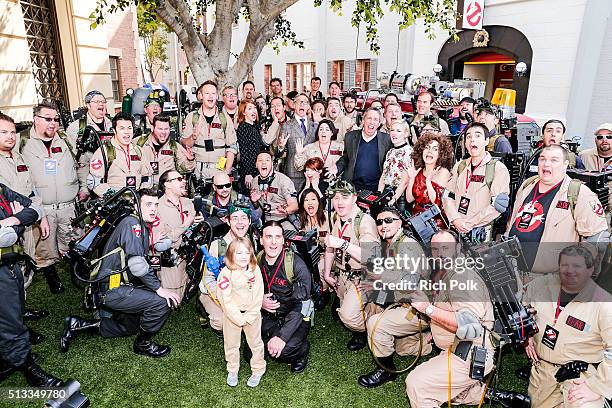 Director Paul Feig, producer Jessie Henderson, writer Katie Dippold, producer Ivan Reitman and the fans pose for a photo at the Ghostbusters Fan...