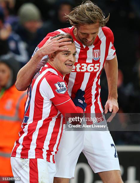 Xherdan Shaqiri celebrates with Peter Crouch after scoring the opening goal during the Barclays Premier League match between Stoke City and Newcastle...