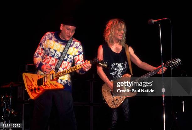 American musicians Rick Nielsen and Robin Zander of the band Cheap Trick perform at the Riviera Theater, Chicago, Illinois, December 31, 1988.