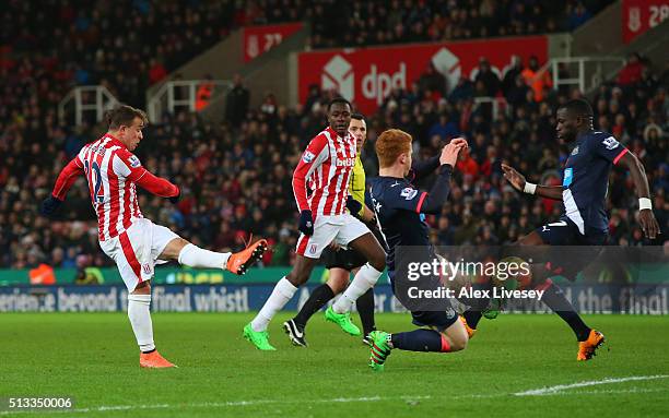 Xherdan Shaqiri of Stoke City scores the opening goal during the Barclays Premier League match between Stoke City and Newcastle United at the...