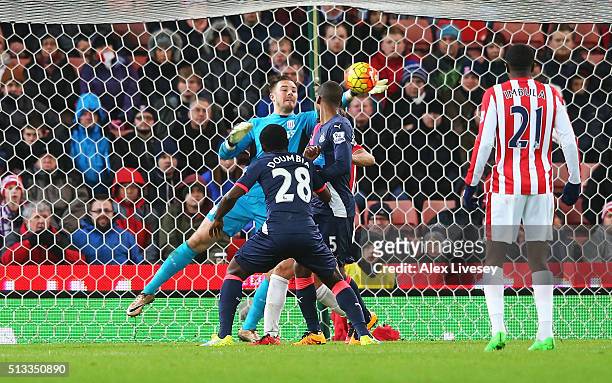 Jack Butland goalkeeper of Stoke City makes a late save from Seydou Doumbia of Newcastle United during the Barclays Premier League match between...