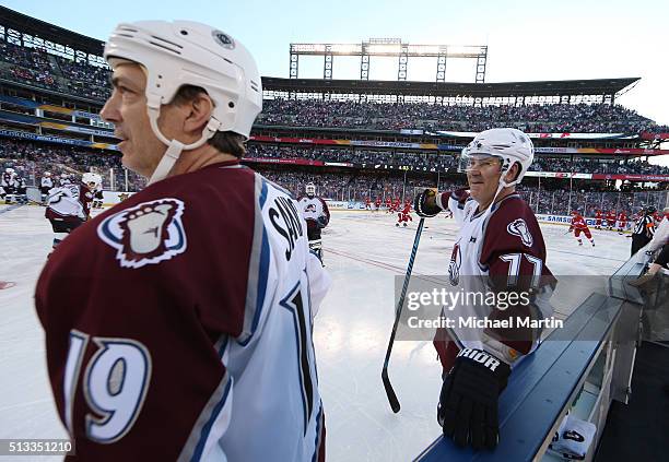 Joe Sakic and Ray Bourque of the Colorado Avalanche Alumni team skate during warm ups prior to the game against the Red Wings Alumni team at the 2016...