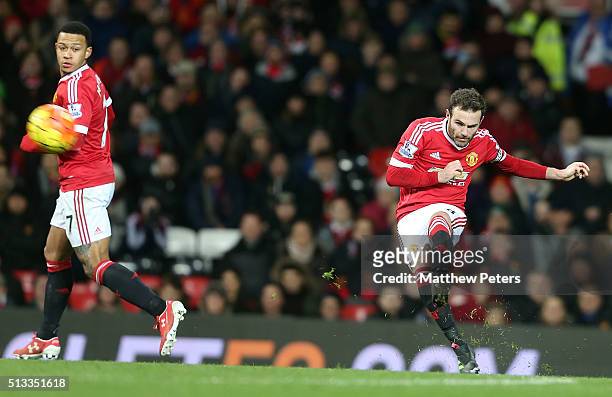 Juan Mata of Manchester United scores their first goal during the Barclays Premier League match between Manchester United and Watford at Old Trafford...
