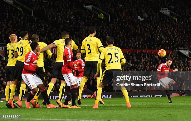 Juan Mata of Manchester United scores the opening goal from a free kick during the Barclays Premier League match between Manchester United and...