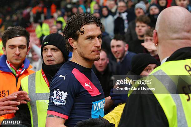 Daryl Janmaat of Newcastle United is confronted by unhappy Newcastle fans after the Barclays Premier League match between Stoke City and Newcastle...