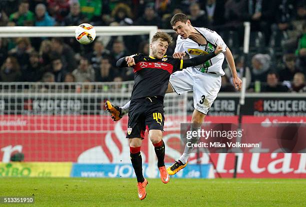 Alexandru Maxim of Stuttgart jumops for a header against Andreas Christensen of Moenchengladbach during the Bundesliga match between Borussia...