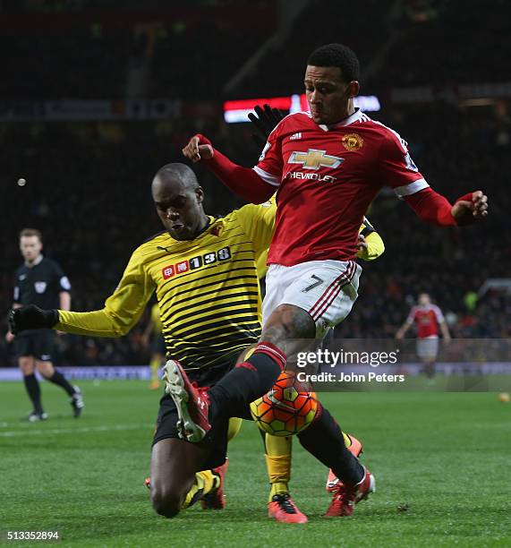 Memphis Depay of Manchester United in action with Allan Nyom of Watford during the Barclays Premier League match between Manchester United and...