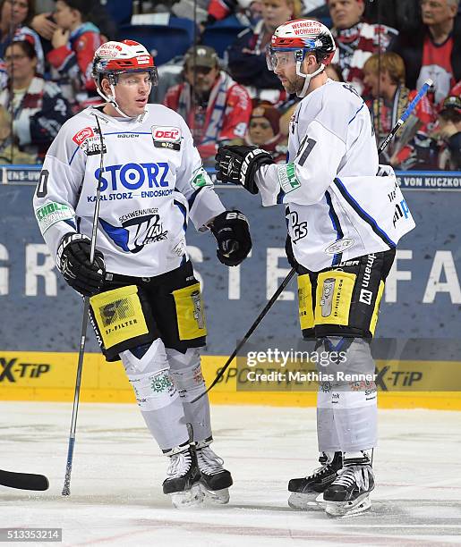 Marcel Kurth and Will Acton of the Schwenninger Wild Wings celebrate after scoring the 2:2 during the game between the Eisbaeren Berlin and the...