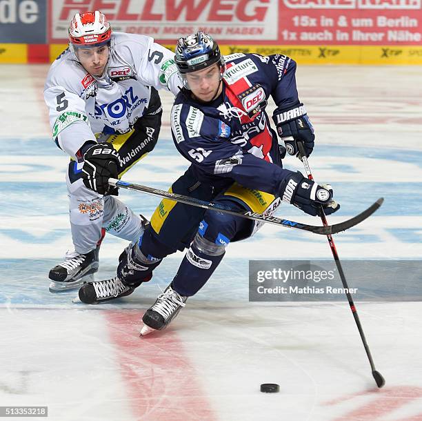 Alex Trivellato of the Schwenninger Wild Wings and Sven Ziegler of the Eisbaeren Berlin during the game between the Eisbaeren Berlin and the...