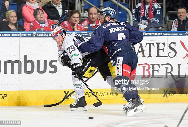 Yan Stastny of the Schwenninger Wild Wings and Henry Haase of the Eisbaeren Berlin during the game between the Eisbaeren Berlin and the Schwenninger...