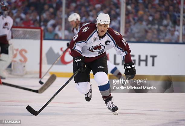 Joe Sakic of the Colorado Avalanche Alumni team skates against the Red Wings Alumni team at the 2016 Coors Light Stadium Series at Coors Field on...