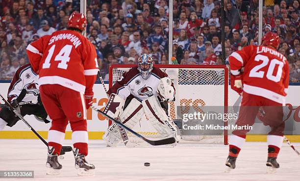 Goaltender Patrick Roy of the Colorado Avalanche Alumni team stands in goal against the Red Wings Alumni team at the 2016 Coors Light Stadium Series...