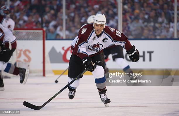 Joe Sakic of the Colorado Avalanche Alumni team skates against the Red Wings Alumni team at the 2016 Coors Light Stadium Series at Coors Field on...