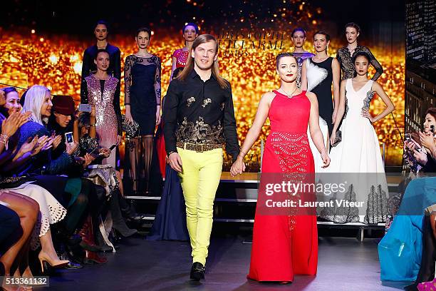 Designer Christophe Guillarme and Singer Priscilla Betti walk the runway for Final during the Christophe Guillarme show as part of the Paris Fashion...