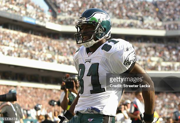 Terrell Owens of the Philadelphia Eagles celebrates his 20 yard touchdown reception in the corner of the end zone against the New York Giants at 6:24...