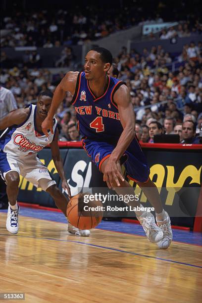 Howard Eisley of the New York Knicks dribbles the ball to the basket during the game against the Los Angeles Clippers at the STAPLES Center in Los...