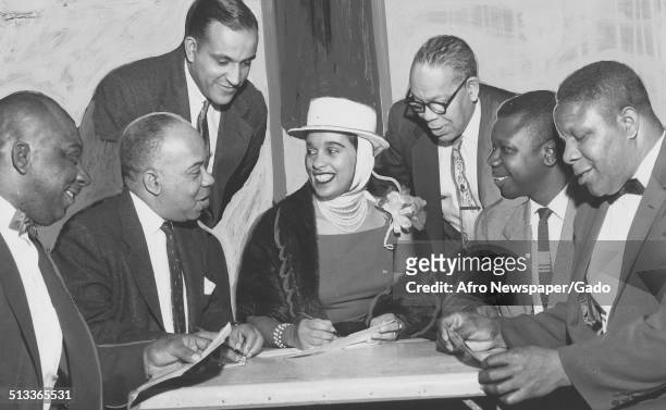 Jazz musician Harry Belafontes wife Marguerite Belafonte and men, April, 1957.