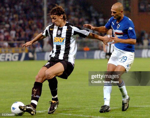 Zlatan Ibrahimovic of Juventus and Giulio Falcone of Sampdoria in action during the Serie A match at Marassi Stadium September 22, 2004 in Genova,...