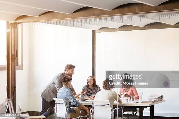 young business colleagues in board - office worker chatting bildbanksfoton och bilder
