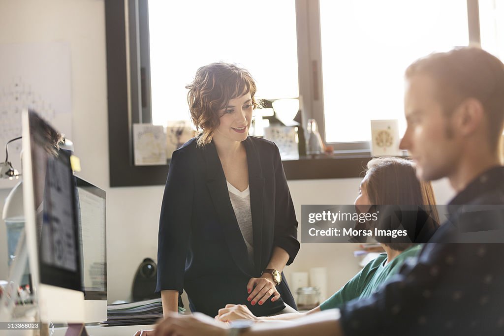 Businesswoman discussing with colleague