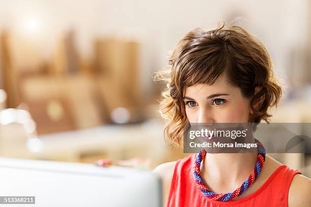 businesswoman using computer in office - messa a fuoco foto e immagini stock